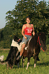 woman with horse and dog