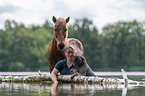woman with Islandic horse and poodle