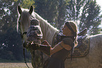woman with horse and Eurasian eagle owl