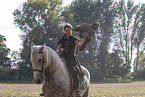 woman with horse and Eurasian eagle owl