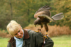 woman and Harris hawk