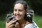 woman with young raccoons
