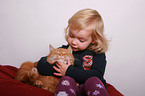 kid and domestic cat