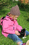 child and domestic cat