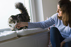 woman with Norwegian Forest Cat