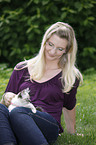 woman with Sacred Birman kitten
