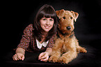 young woman with Airedale Terrier