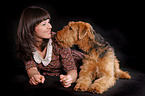 young woman with Airedale Terrier