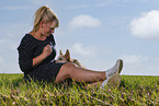 young woman with Australian Cattle Dog puppy