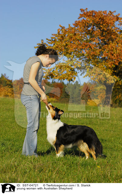 young woman with Australian Shepherd / SST-04721