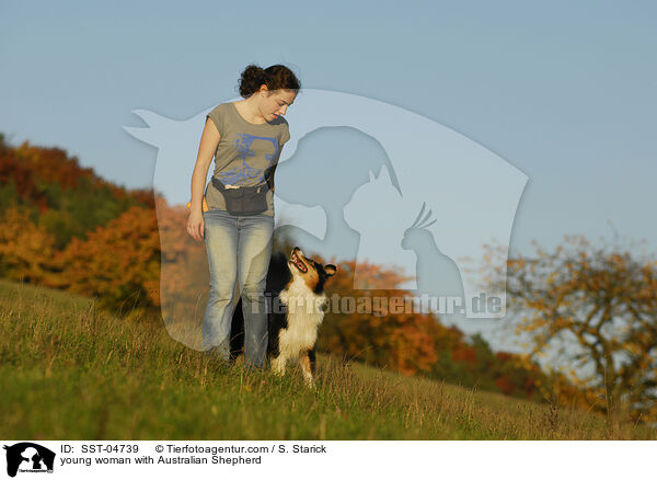 young woman with Australian Shepherd / SST-04739
