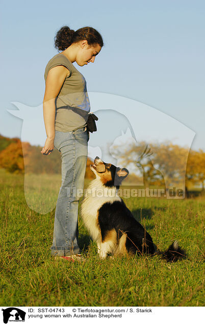 young woman with Australian Shepherd / SST-04743