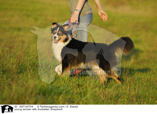 young woman with Australian Shepherd / SST-04744