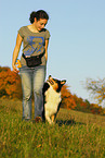 young woman with Australian Shepherd