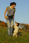young woman with Australian Shepherd