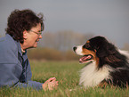 woman and Australian Shepherd