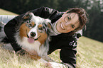 woman and Australian Shepherd
