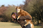 woman and Australian Shepherd