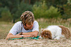 woman and Australian Shepherd