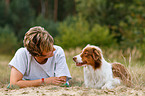 woman and Australian Shepherd