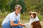 woman and Australian Shepherd