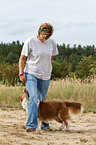 woman and Australian Shepherd