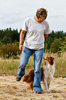 woman and Australian Shepherd
