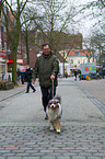 man and Australian Shepherd