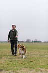 man and Australian Shepherd