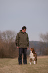 man and Australian Shepherd