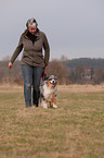 woman and Australian Shepherd