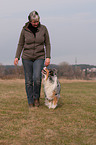 woman and Australian Shepherd