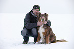 man with Australian Shepherd