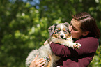 woman and Australian Shepherd Puppy