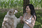 woman and Australian Shepherd