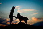 woman and Australian Shepherd