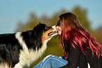 woman with Australian Shepherd