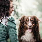 woman with Australian Shepherd