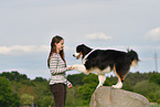 woman with Australian Shepherd