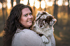 woman with Australian Shepherd