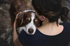 woman and Australian Shepherd