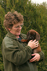 woman with Bavarian Mountain Hound puppy