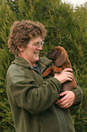 woman with Bavarian Mountain Hound puppy