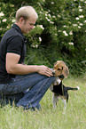 puppy jump at man