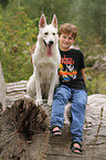 boy and White Swiss Shepherd
