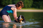 woman and young Bernese Mountain Dog
