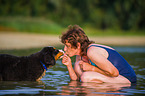 woman and young Bernese Mountain Dog
