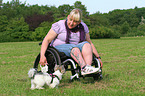 woman and Biewer Yorkshire Terrier