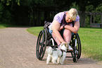 woman and Biewer Yorkshire Terrier