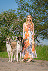 woman and 2 Borzois
